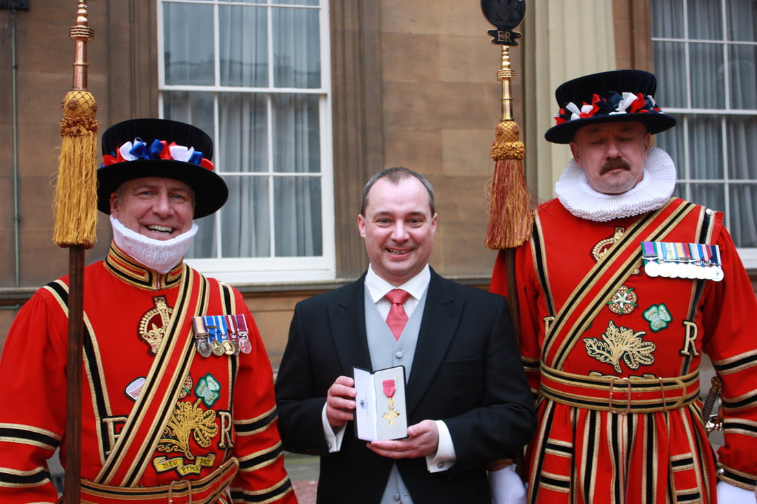 Richard Wilding with Yeomen of the Guard at Buckingham Palace.